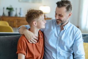Father and son embracing.