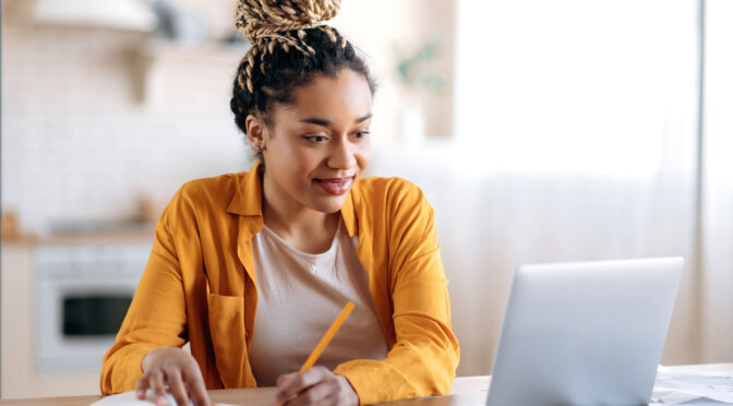 Employee doing work on her laptop.