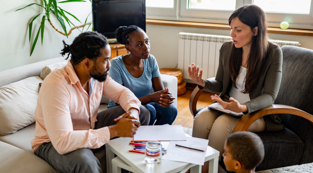 Foster care case manager visiting family during a foster home check-in