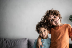 Young siblings smiling together